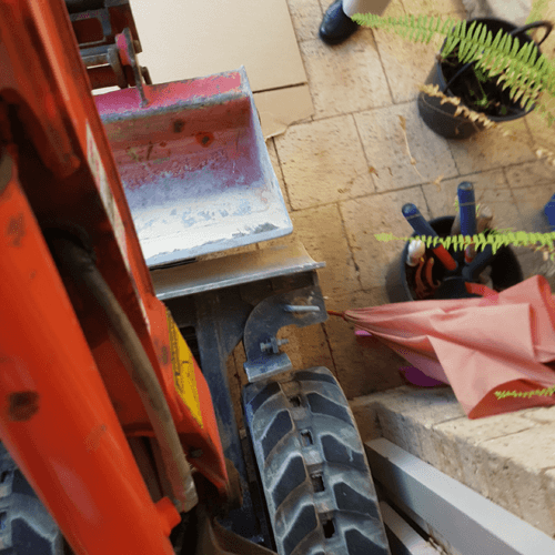 Excavator through door