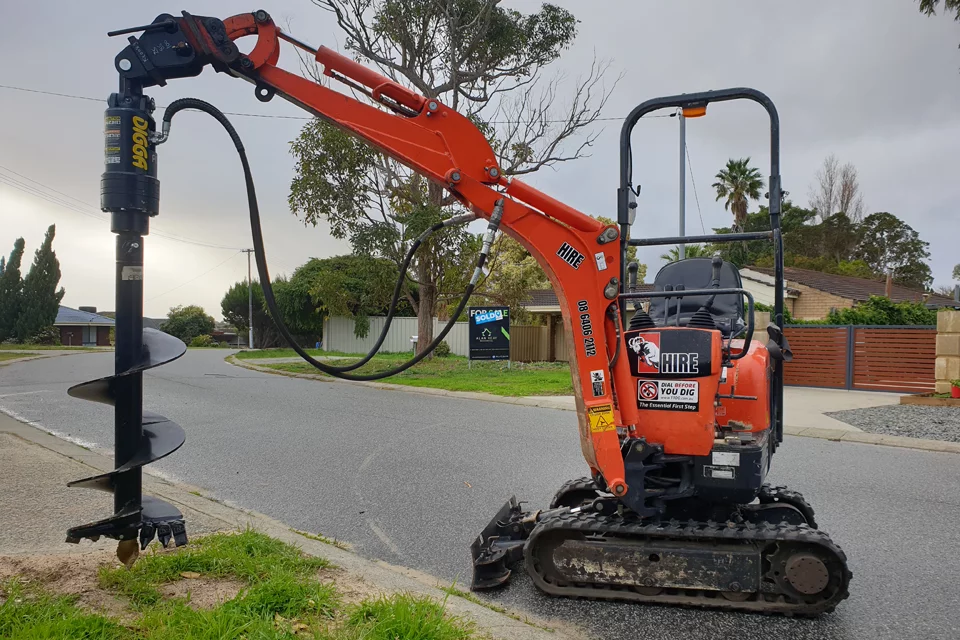 mini-excavator-auger Mini excavator with auger attachment