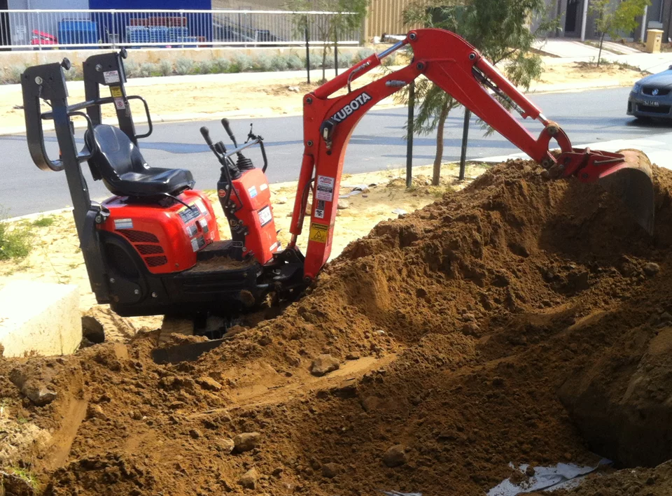 mini-excavator-pile-sand Mini excavator excavating sand