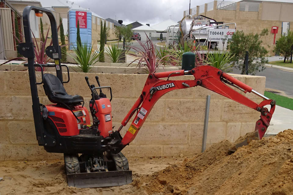 Side shot of mini excavator